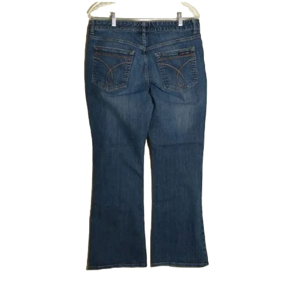 Calvin Klein medium wash mid-rise bootcut women's jeans. 12. - Picture 2 of 12